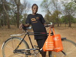 Christine stand proudly behind her brand new bike.