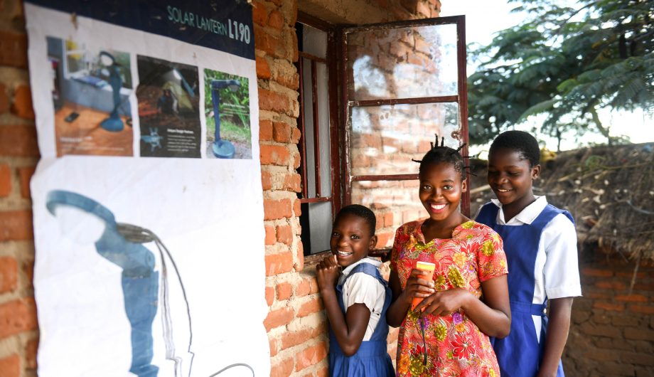 Aliya and her firends rent a torch in Malawi.