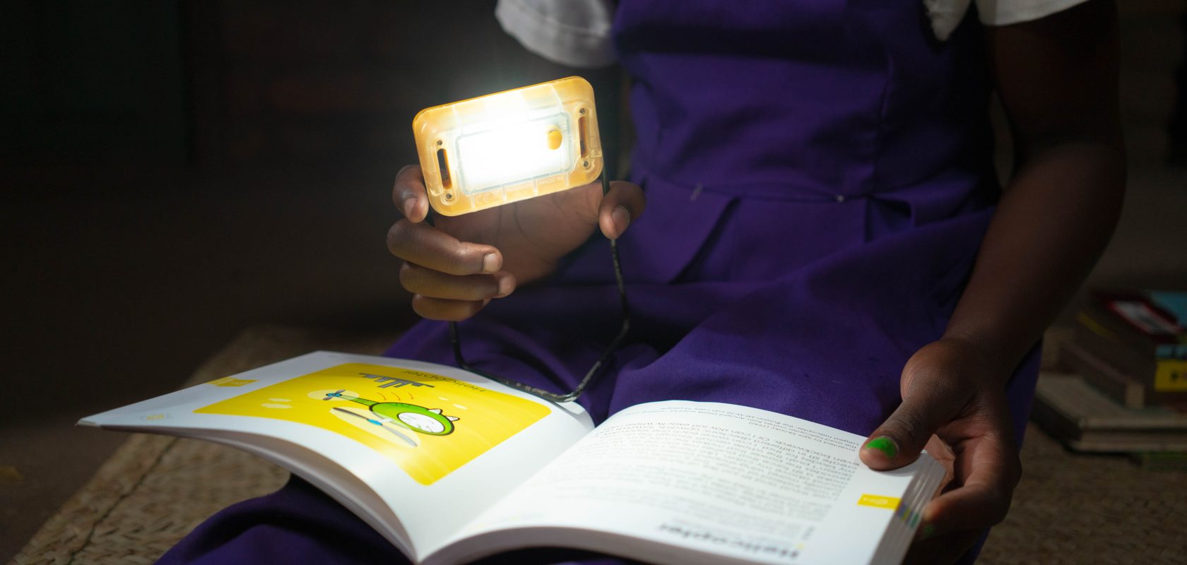 A solar light above a book.