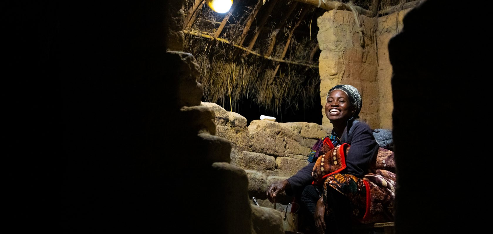 Sylvia enjoys her solar light in her home.