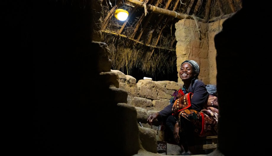 Sylvia enjoys her solar light in her home.
