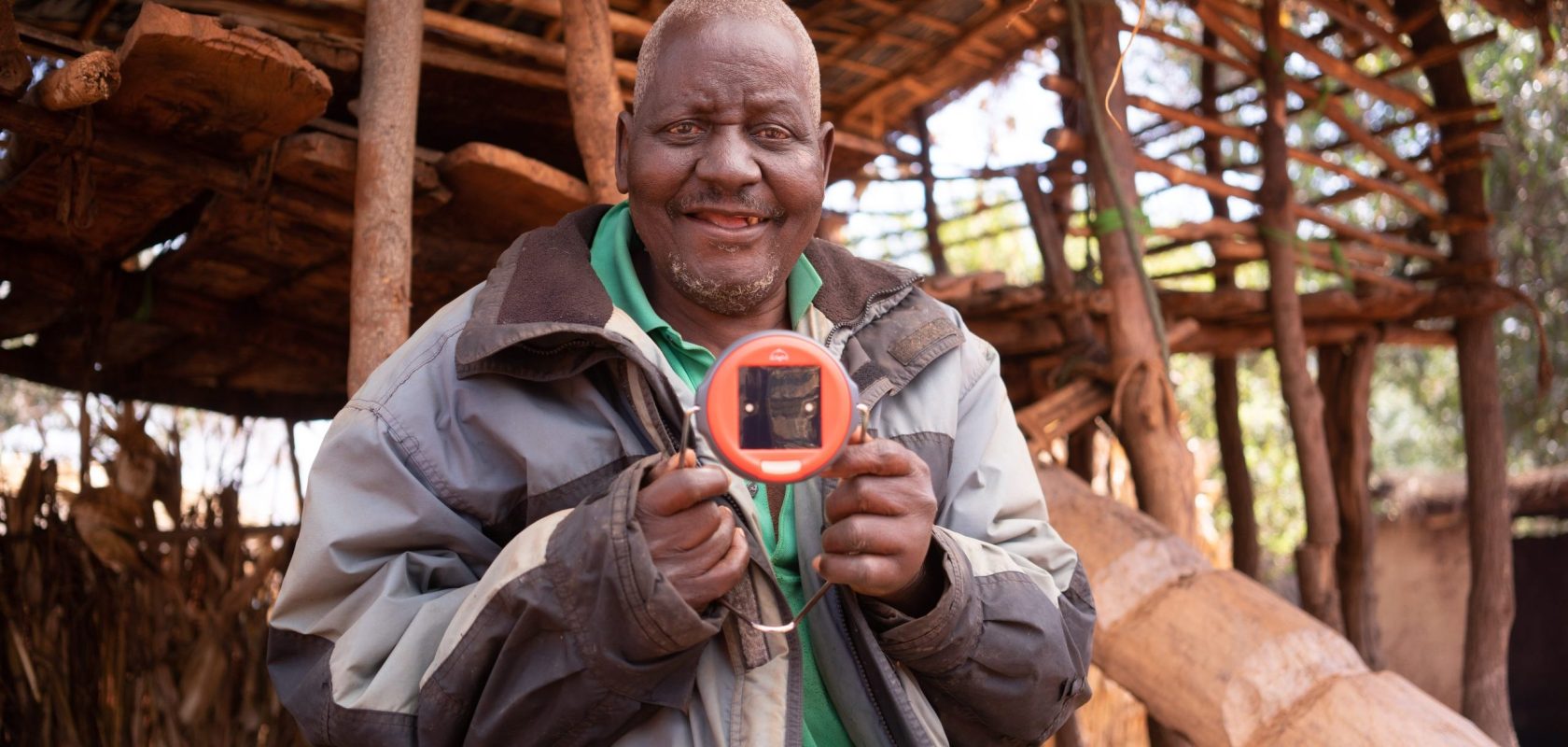 John holds his solar light proudly.
