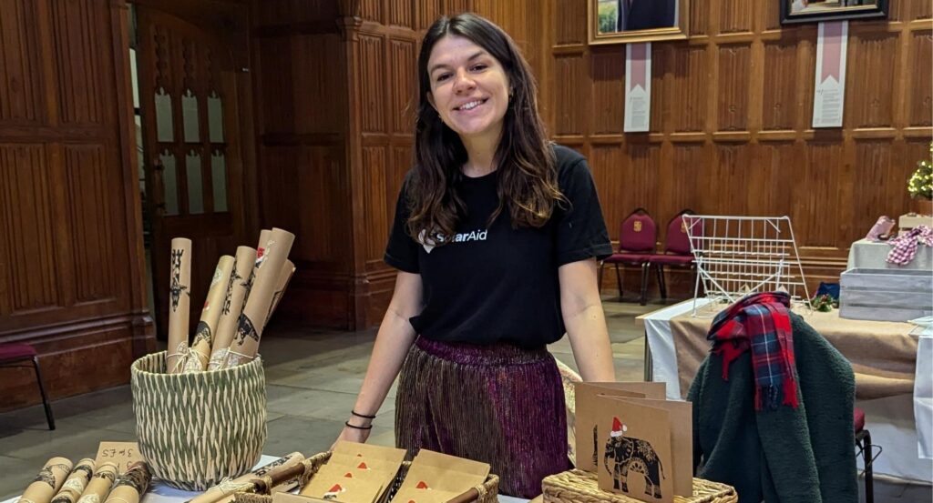 Emily selling homemade wrapping paper at Bristol University Christmas fair